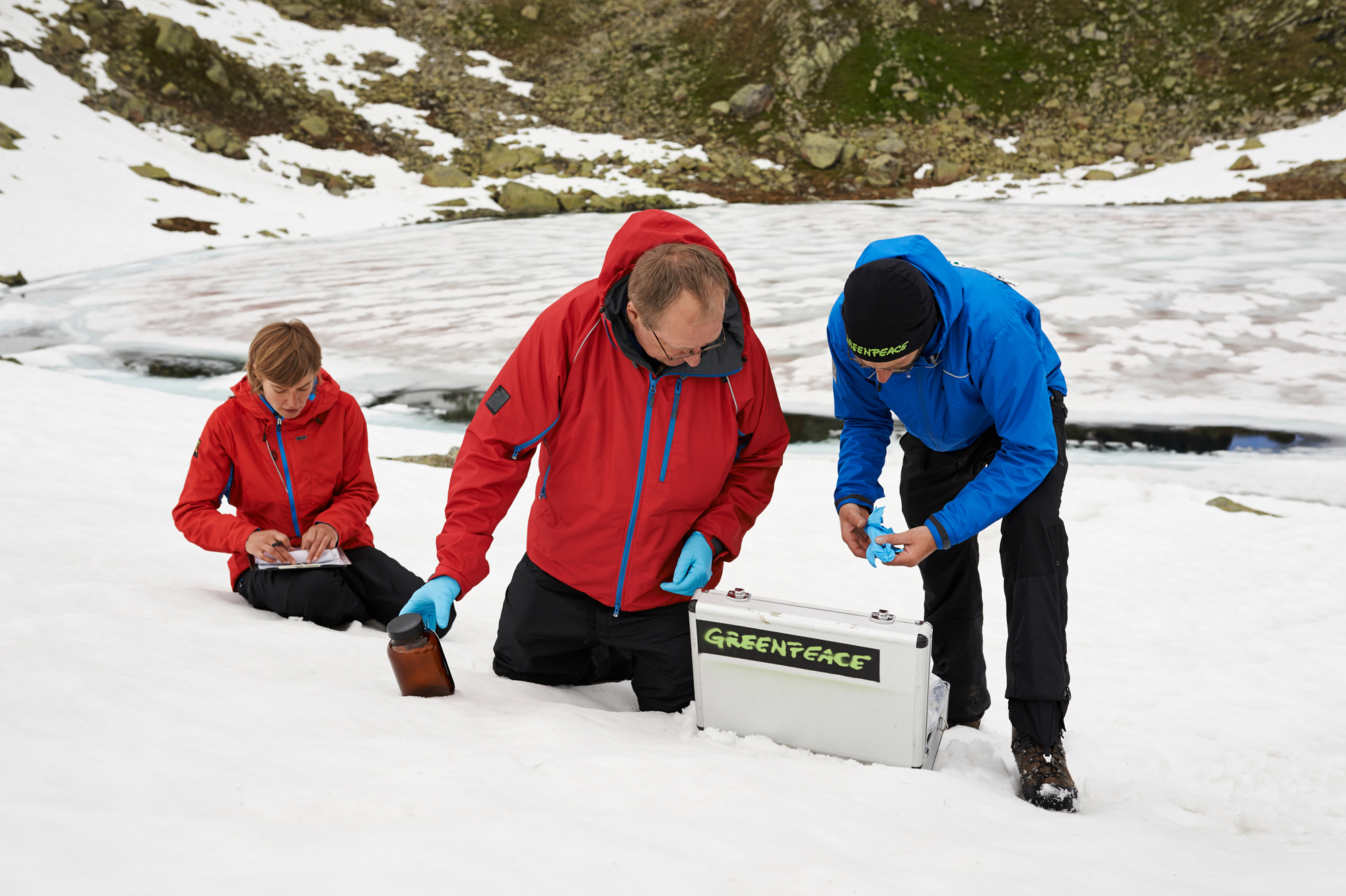 Greenpeace scientists collect water and snow samples to test for PFCs. 