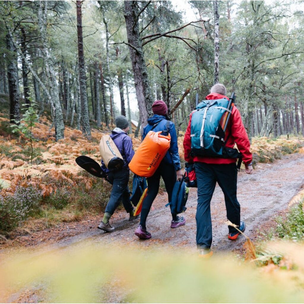 Three walkers with full kit and various clothing layers 