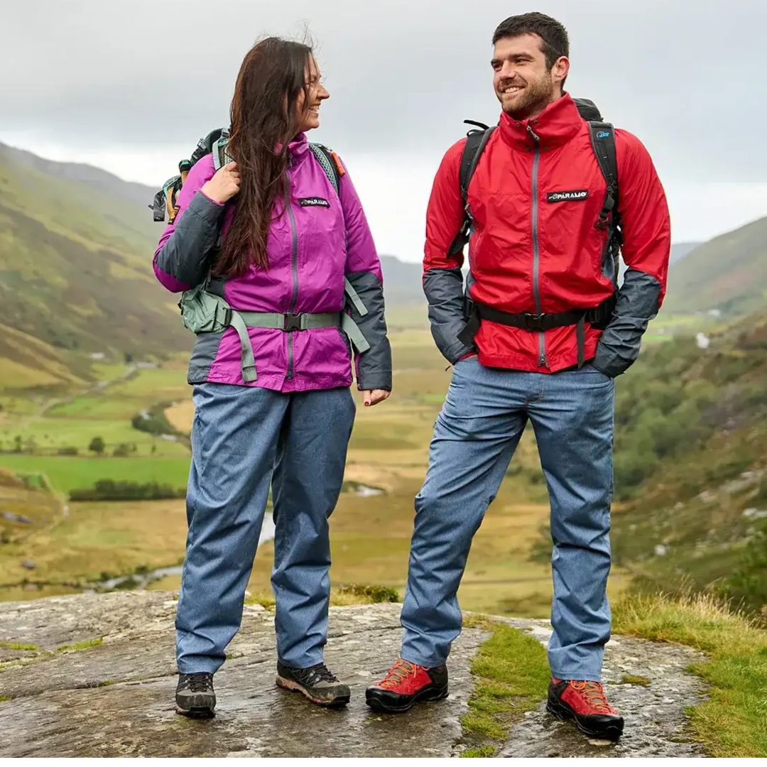 Man and woman on mountainside wearing their Valez windproof jackets